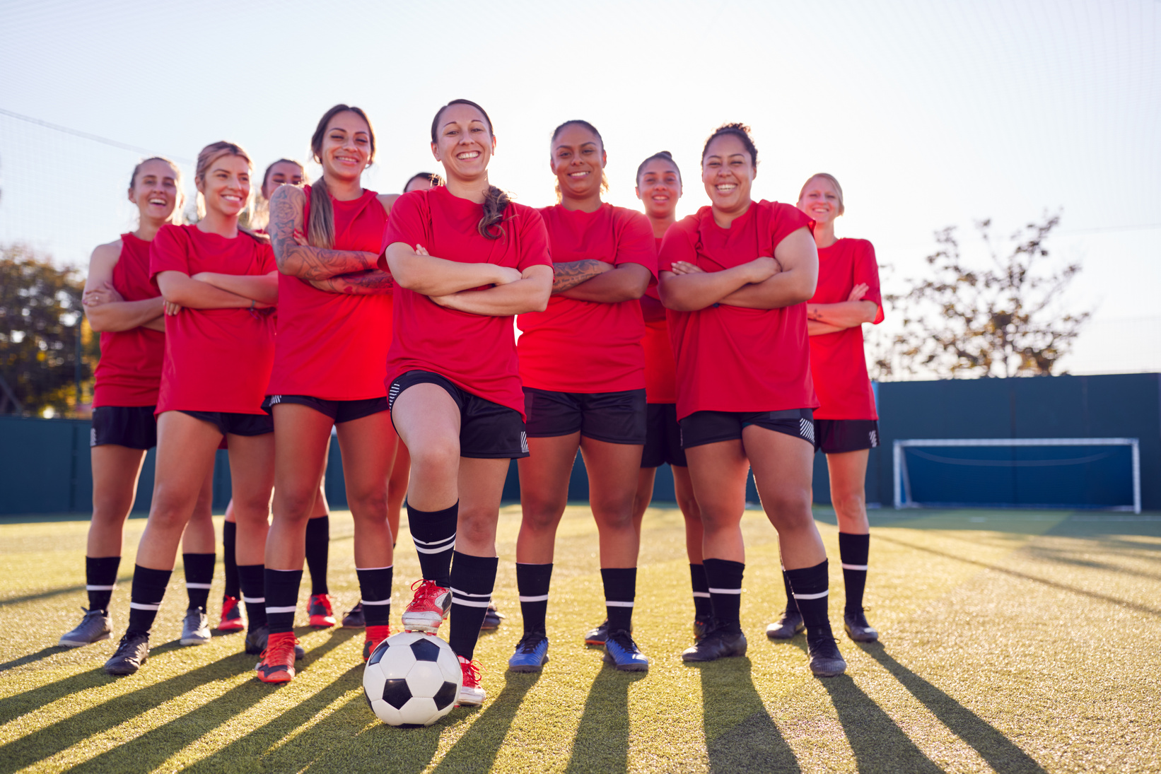 Portrait of Smiling Womens Football Team Training for Soccer Mat
